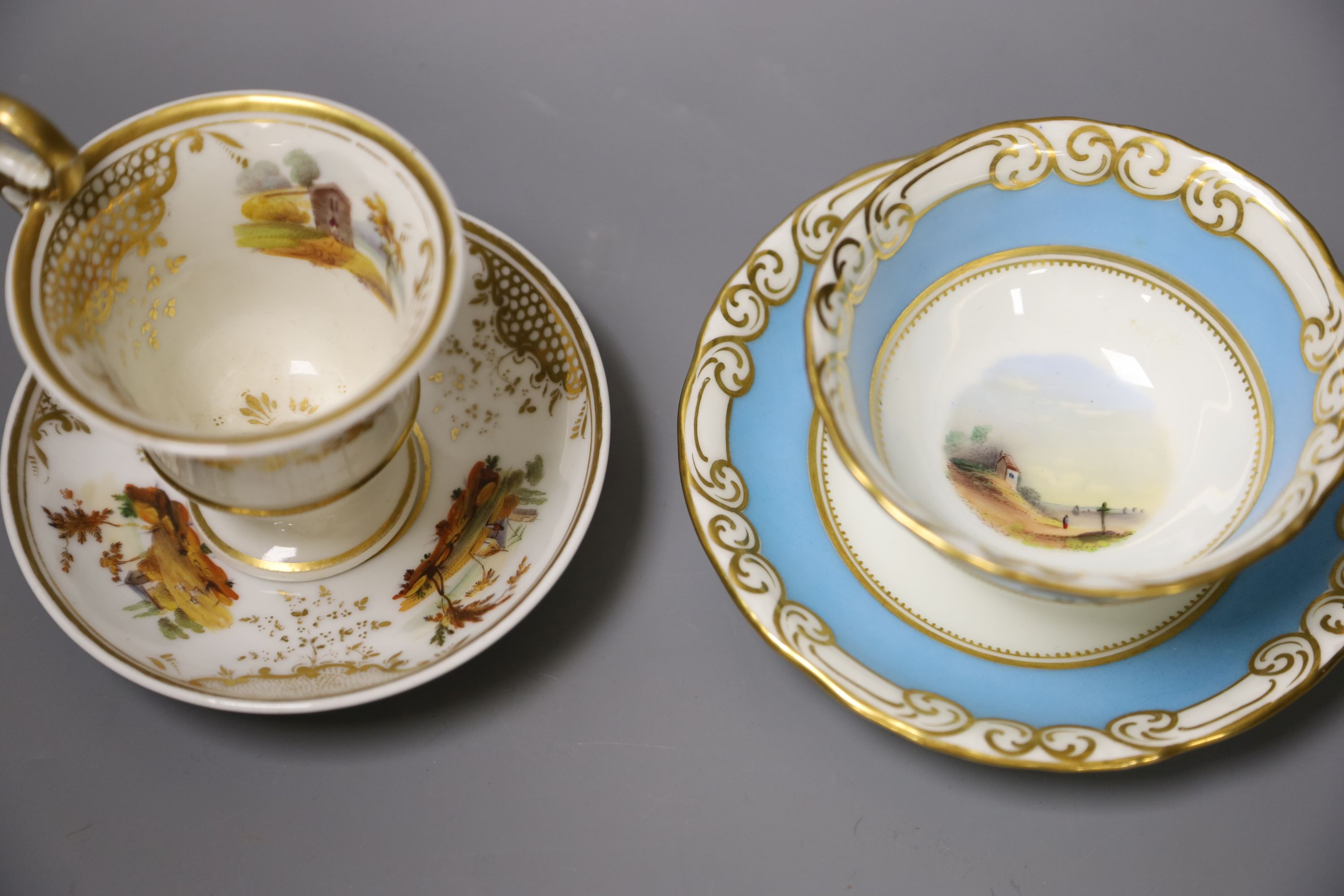 A Graingers Worcester turquoise ground teacup and saucer painted with landscapes, Royal Warrant mark and a high pedestal coffee cup